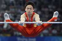 Zou Kai se proclamó triunfador en los ejercicios de barra fija, lo que le significó su tercera medalla de oro en la justa veraniega