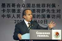 El presidente Felipe Calderón durante su alocución ante hombres de negocios chinos, a quienes invitó a invertir en México