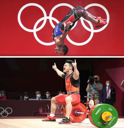 El halterista sudamericano Julio Mayora festeja su medalla de plata en los 73 kilogramos, prueba en la que se impuso el chino Shi Zhiyong, quien batió su propio récord mundial.