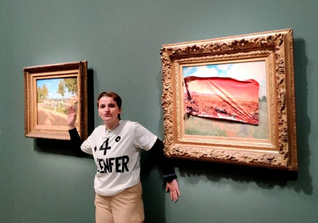 Activist pastes adhesive poster on Monet portray on the Orsay Museum
