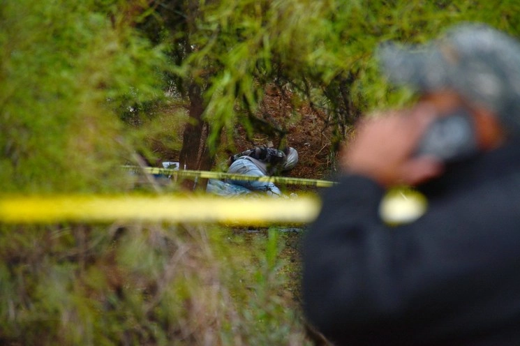 Así se encontró a una de las personas asesinadas. Foto La Jornada