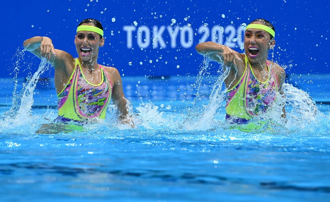 La dupla mexicana presentó una ejecución dinámica acompañada de la canción 'Maniac' y un 'look' ochentero en el Centro Acuático de Tokio durante la justa olímpica, el 3 de agosto de 2021. Foto Afp