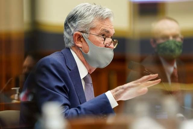 Powell dijo que el país aún se mantiene lejos de donde estaba "y el camino a seguir sigue siendo muy incierto... Es probable que se produzca una recuperación completa sólo cuando la gente confíe en que es seguro volver a participar en una amplia gama de actividades". Foto Joshua Roberts / Pool / Afp