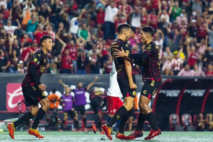 Jugadores de Tijuana celebrando una de las anotaciones. Foto Xolos