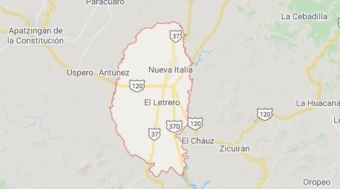 Presuntos productores de mango, limón y hortalizas bloquearon cuatro carreteras en la región de Nueva Italia, municipio de Múgica, luego de despojar a los conductores de varios vehículos de carga. Captura de imagen de Google Maps