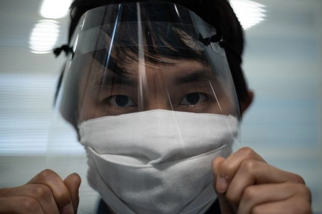 En el caso japonés diversos analistas apuntan que el país aún experimentará efectos dramáticos de la pandemia de Covid-19. Foto Afp 