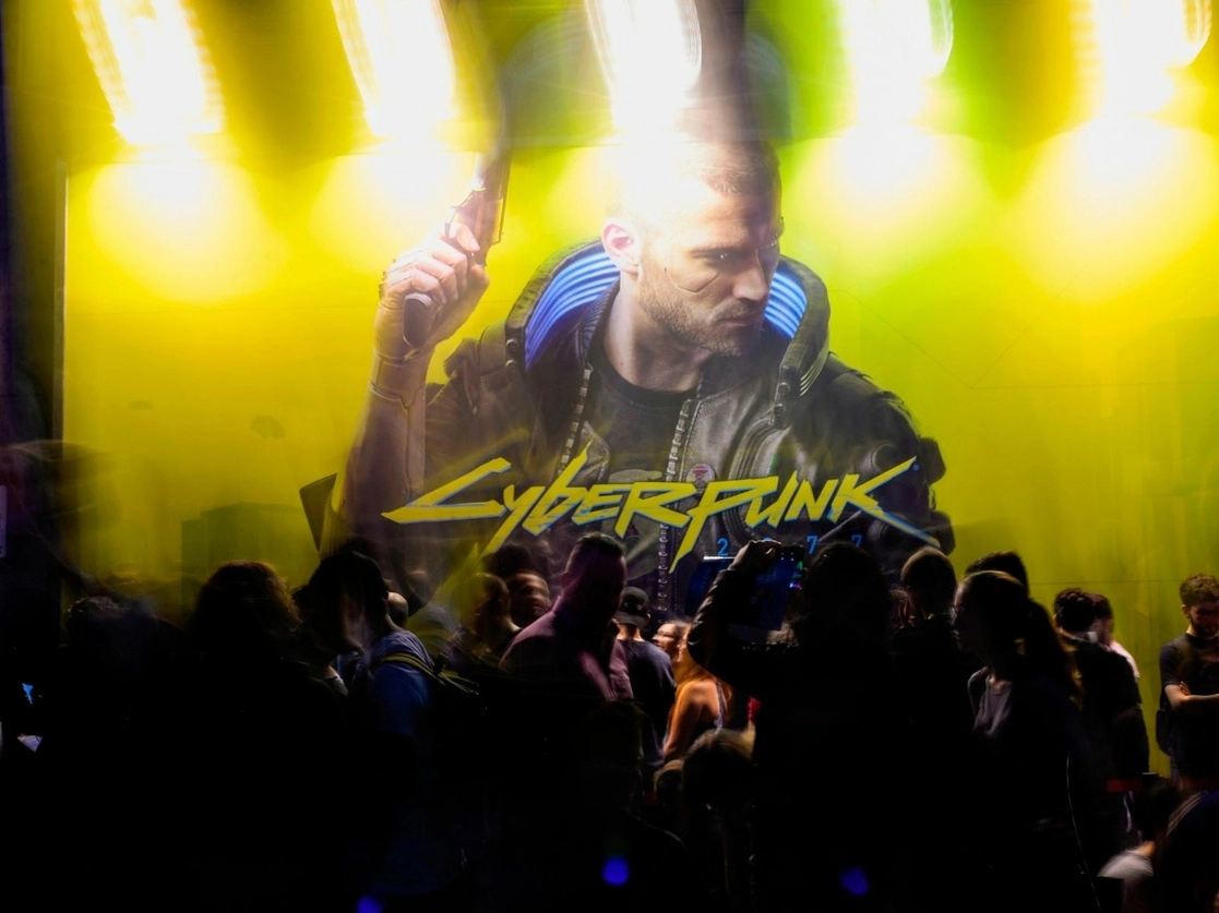 Visitantes esperan en el stand de Cyberpunk 2077 durante la feria de videojuegos Gamescom en Colonia, Alemania e, 21 de agosto de 2019. Foto Afp