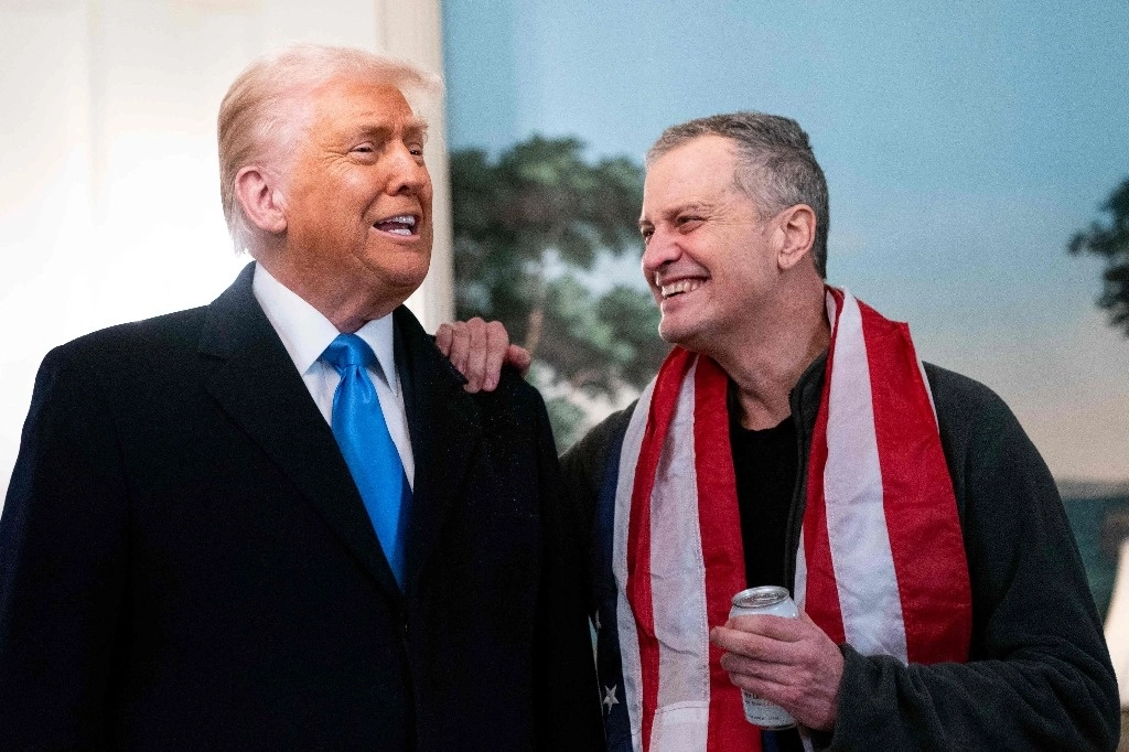 Tras su liberación, Marc Fogel (der.) fue recibido en la Casa Blanca por el presidente Donald Trump. Foto Afp.