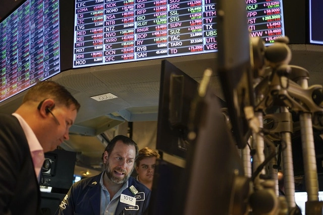 Empleados de la Bolsa de Valores de Nueva York en Nueva York. Foto Ap 