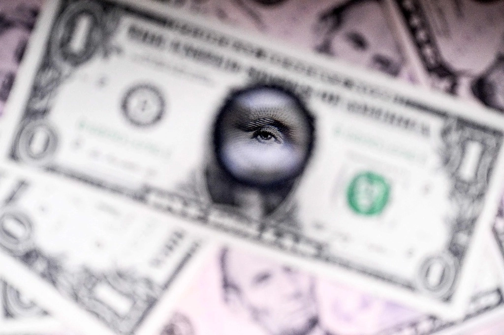 Esta imagen ilustrativa, tomada el 10 de enero de 2025 en Frankfurt am Main, Alemania occidental, muestra una vista parcial del retrato del primer presidente de Estados Unidos, George Washington (1732-1799), en el billete de un dólar estadunidense. Foto Afp