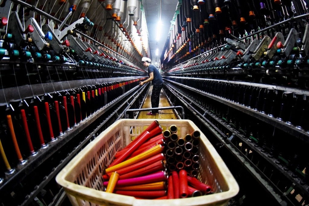 Fabrica textil en la provincia china de Jiangsu. Foto Afp.