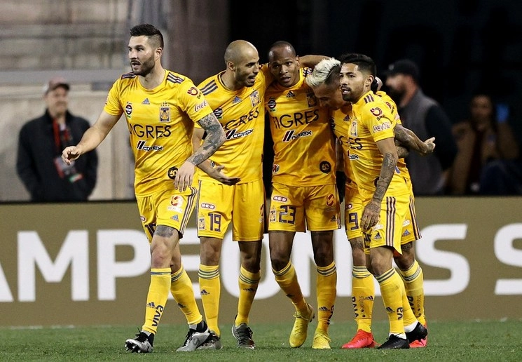Jugadores de Tigres festejan al término del encuentro. Foto Afp